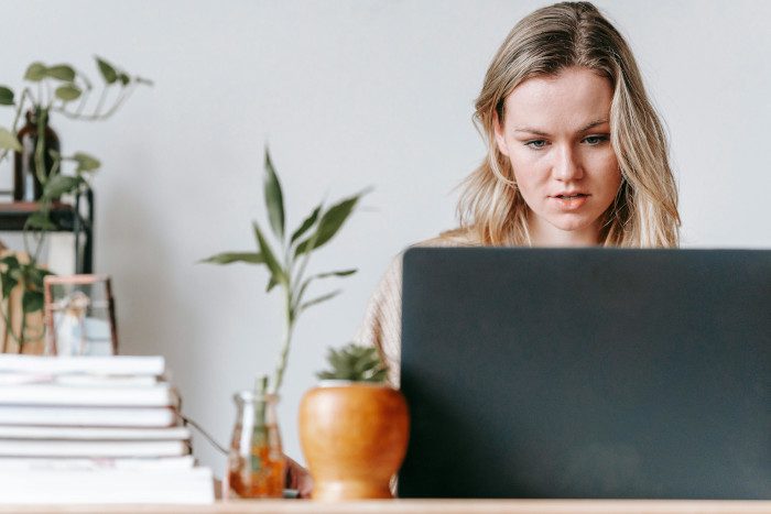 Focused worker working on laptop