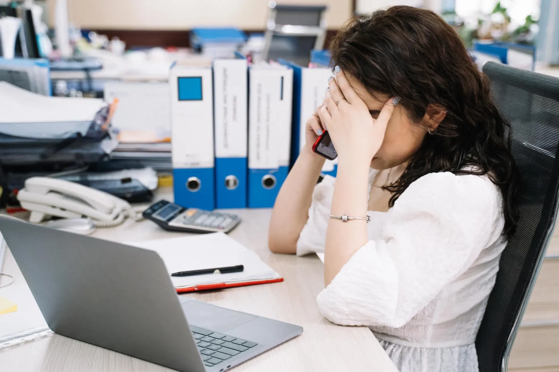 A stressed female office worker after realising he user account has been compromised
